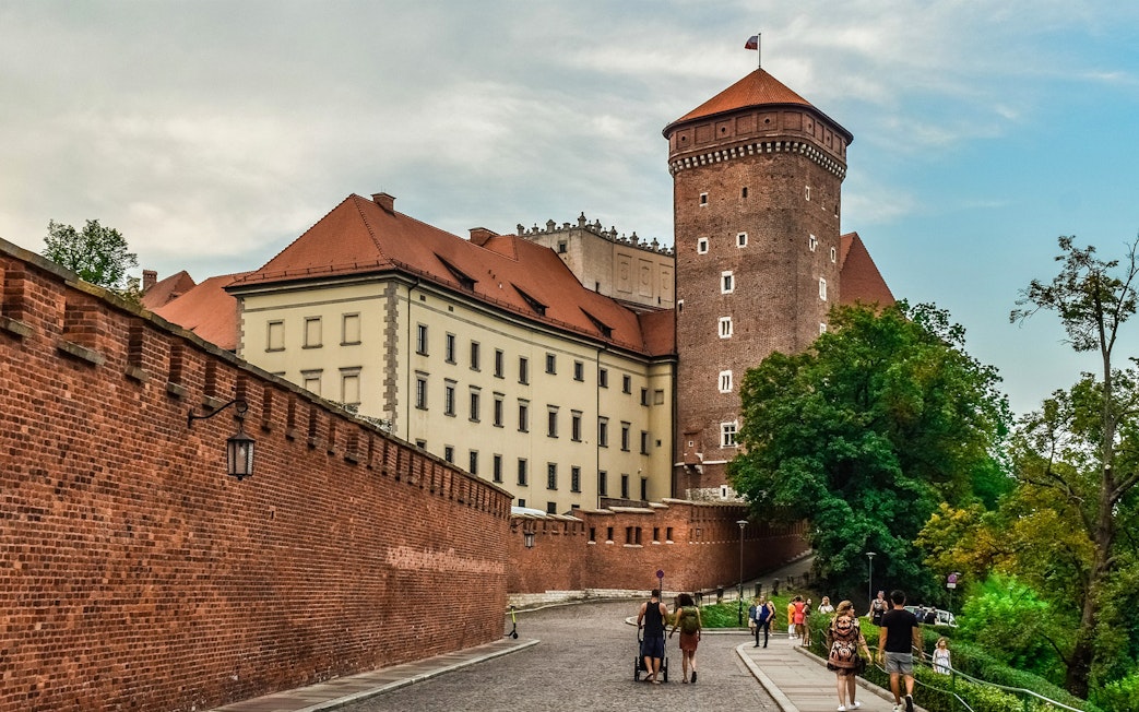 Wawel Castle exterior with tourists on Wawel Hill, Krakow audioguide tour.