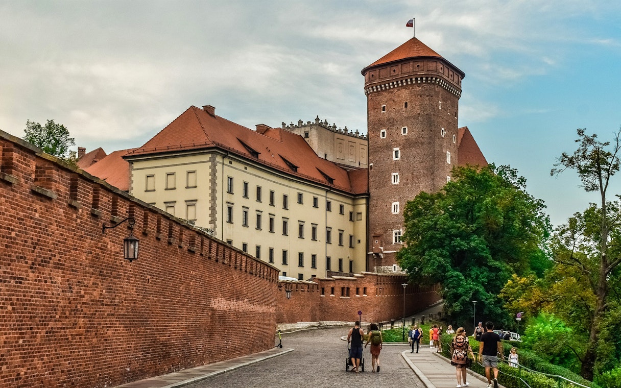 Wawel Castle exterior with tourists on Wawel Hill, Krakow audioguide tour.