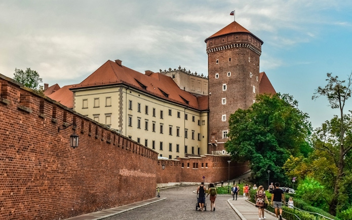 Wawel Castle exterior with tourists on Wawel Hill, Krakow audioguide tour.