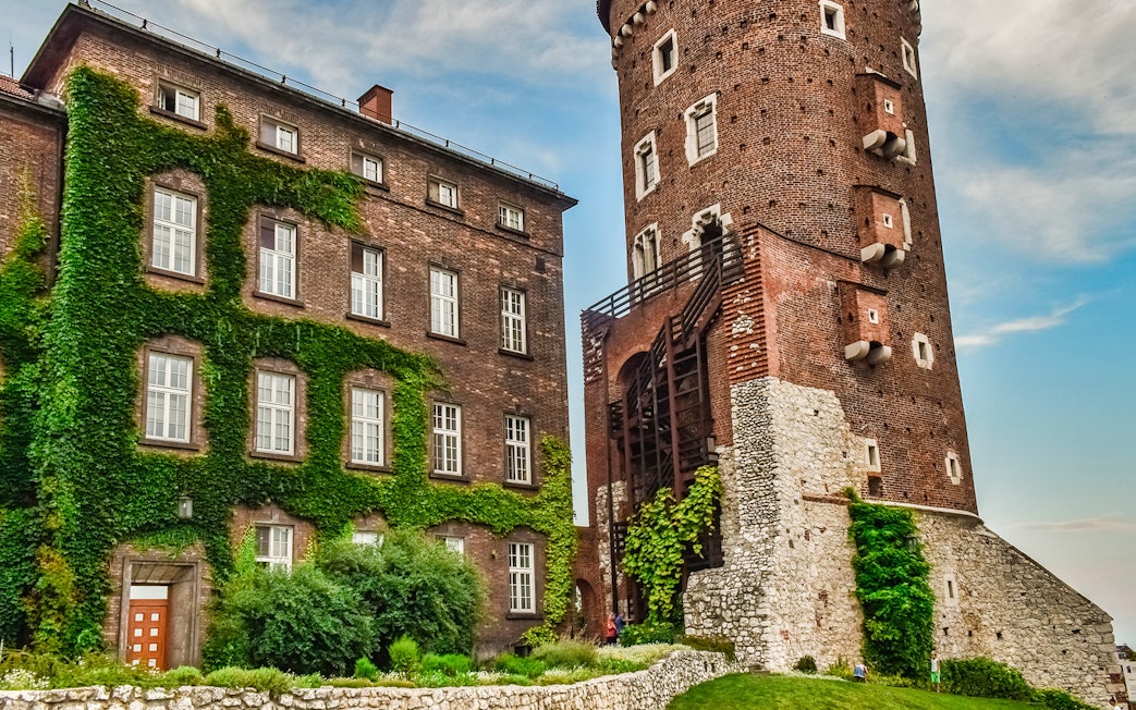 Wawel Castle tower and ivy-covered building on Wawel Hill, Krakow.