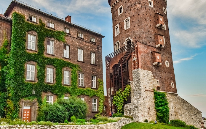 Wawel Castle tower and ivy-covered building on Wawel Hill, Krakow.