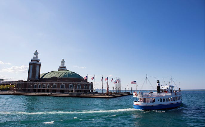 Tour boat near Chicago's Navy Pier on a sunny day during the Chicago Skyline Lake Tour.