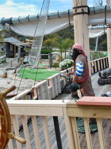 Pirate ship exhibit at Maru Koala and Animal Park, featuring cannons and a ship's wheel.
