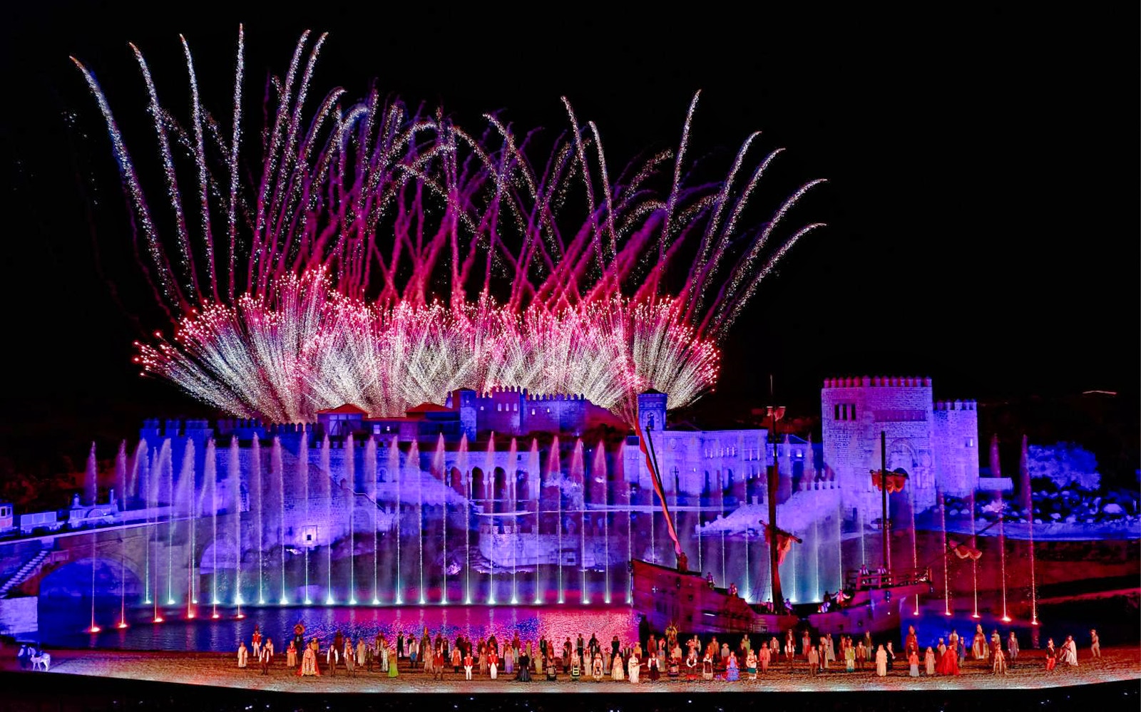 Puy du Fou España night show with performers in historical costumes in Madrid.