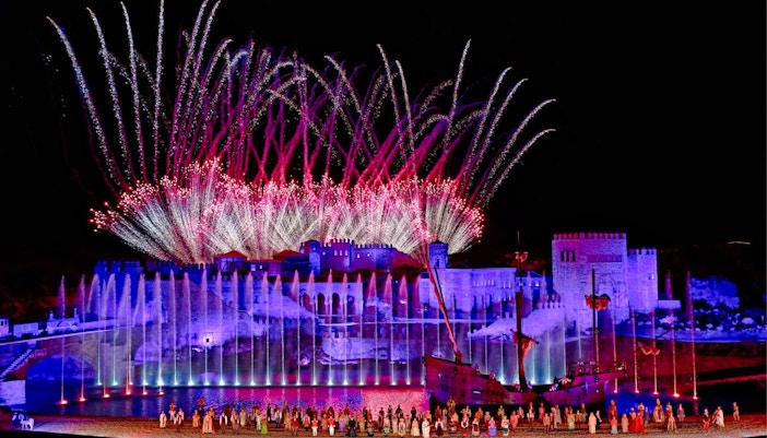 Puy du Fou España night show with performers in historical costumes in Madrid.