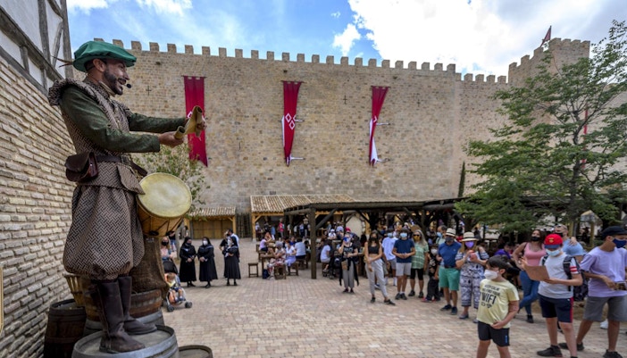 Puy du Fou España entrance with visitors gathering for El Sueño de Toledo night show in Madrid.
