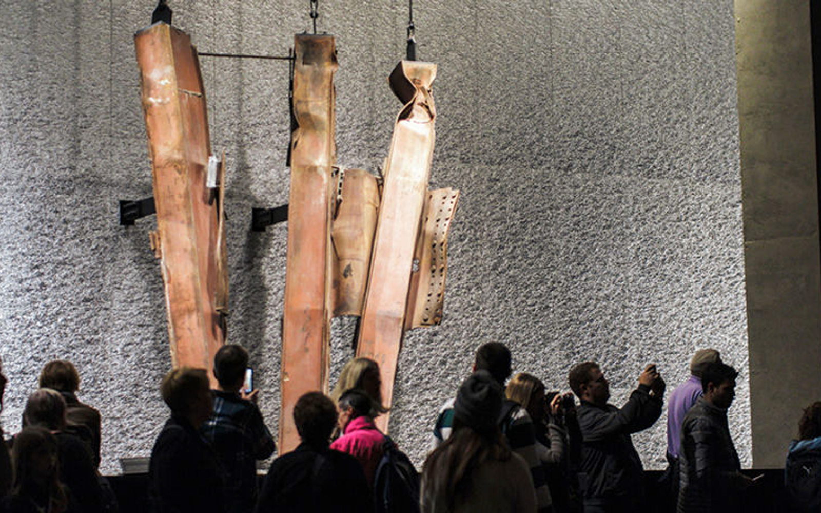 Statue of Liberty with New York City skyline, part of guided tour including Ellis Island and 9/11 Memorial Museum.