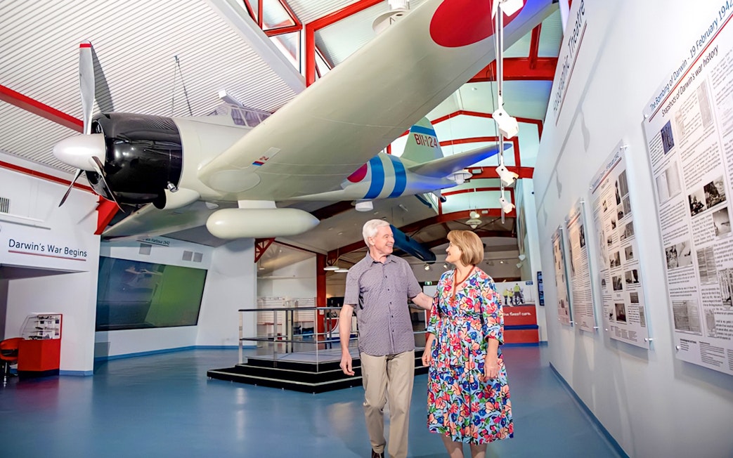 Airplane exhibit at Royal Flying Doctor Service in Darwin with visitors exploring the museum.