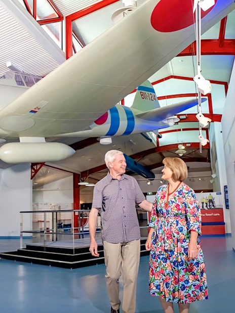 Airplane exhibit at Royal Flying Doctor Service in Darwin with visitors exploring the museum.