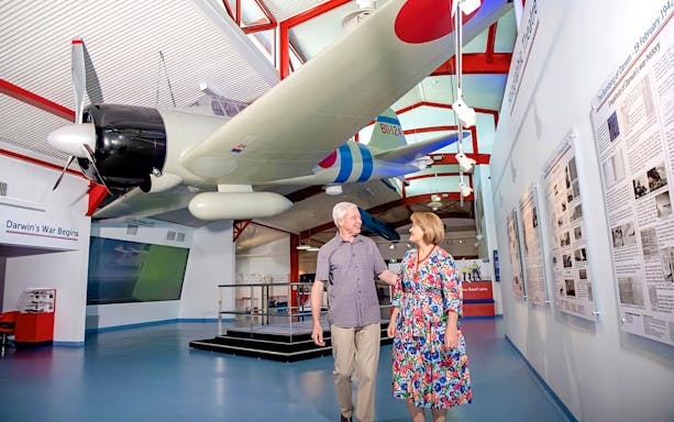 Airplane exhibit at Royal Flying Doctor Service in Darwin with visitors exploring the museum.