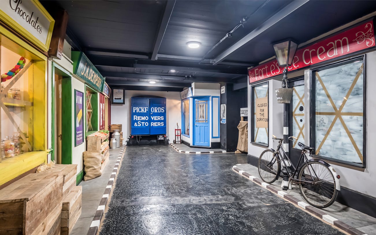 Liverpool War Museum exhibit with vintage shops and a Pickfords removals truck.