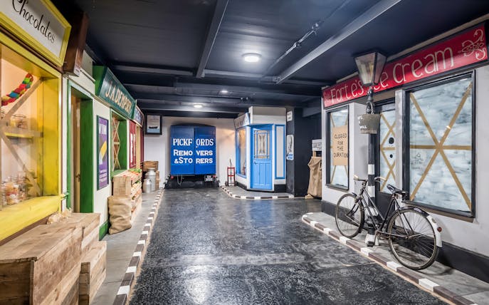 Liverpool War Museum exhibit with vintage shops and a Pickfords removals truck.
