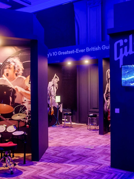 Drum exhibit at The British Music Experience, featuring iconic British musicians.