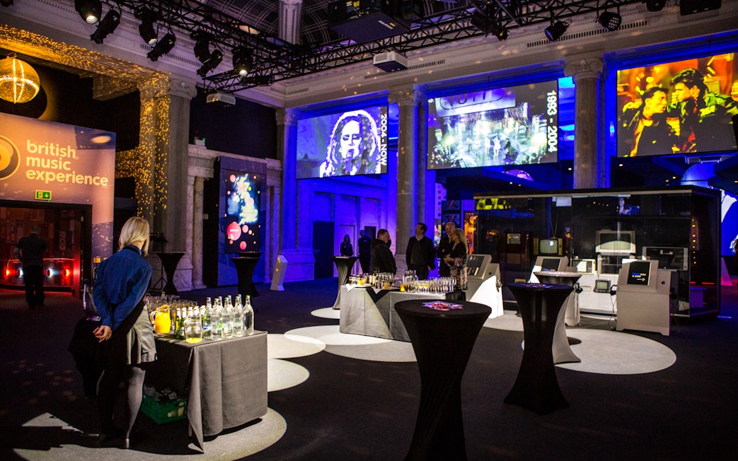 British Music Experience interior with exhibits and video displays.