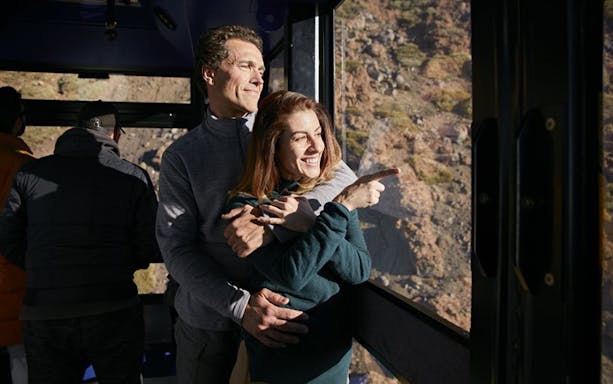Couple enjoying views from Mount Teide cable car towards Pico Viejo viewpoint.