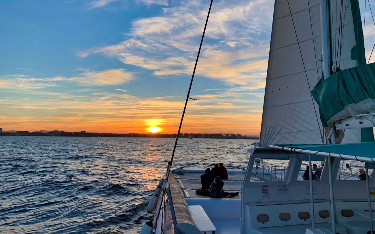 Sailing boat at sunset on a Valencia excursion.