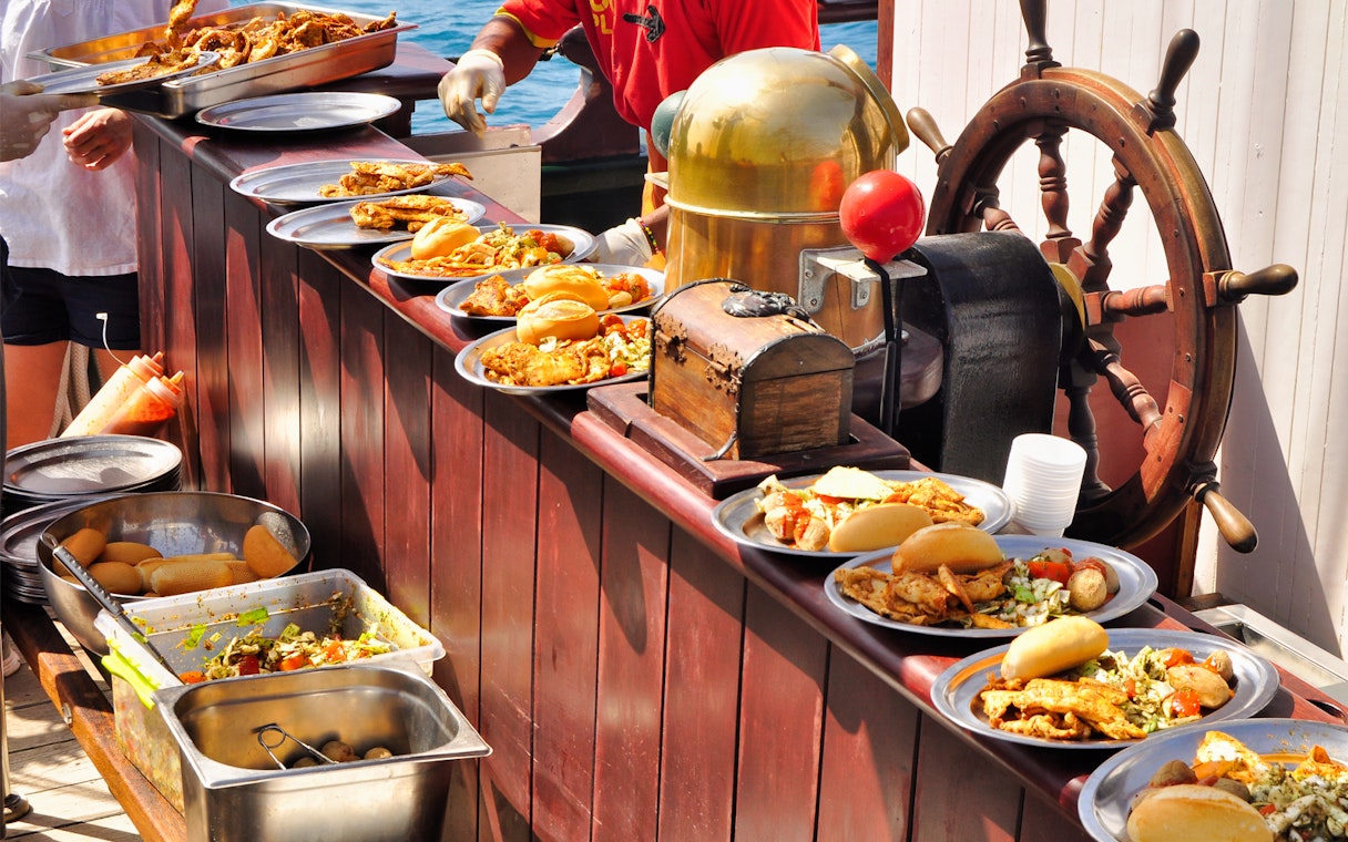 Pirate ship buffet with assorted dishes on Fuerteventura La Aventura Pirata tour.