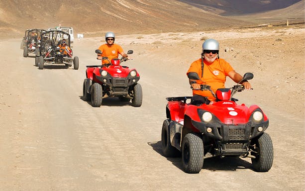 ATV riders exploring desert terrain in Fuerteventura Land Experience.