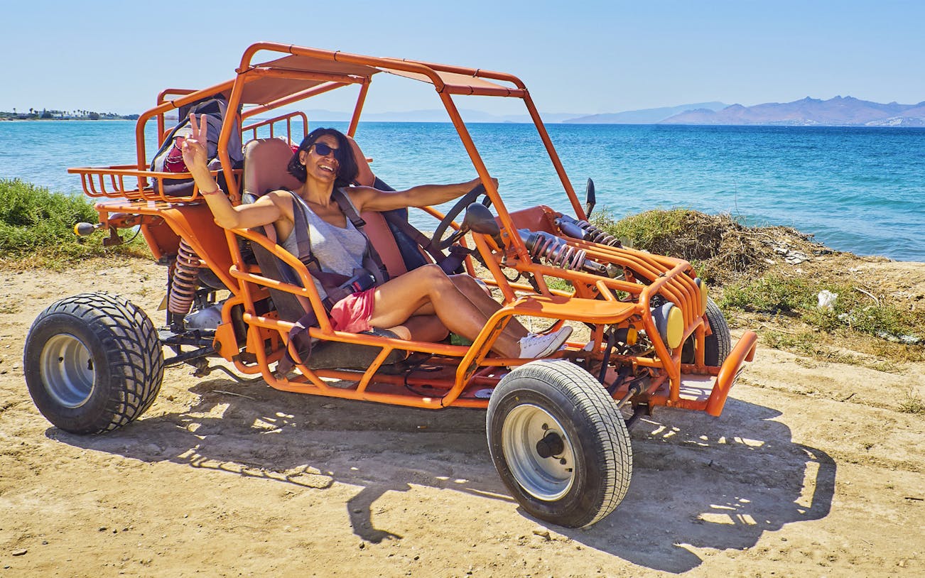 Person enjoying a dune buggy ride along the coast in Fuerteventura.