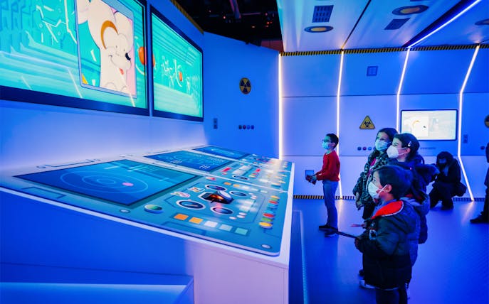 Children exploring interactive displays at SuperThings: The Exhibition.