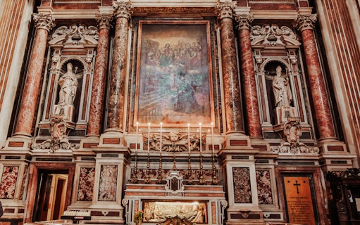 Naples Old Town Centre tour featuring ornate church interior with statues and artwork.