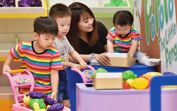 Children playing with toys at Pororo Park indoor playground.
