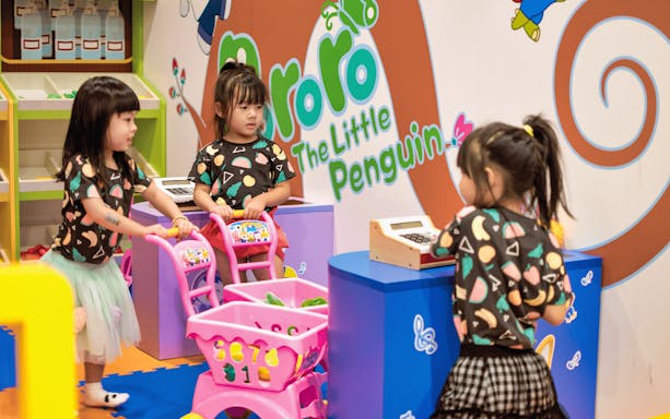 Children playing with toy shopping carts at Pororo Park.