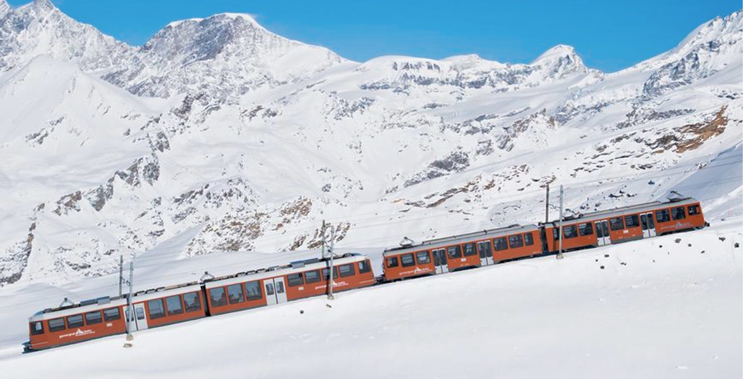 Zermatt to Gornergrat train journey with scenic mountain views.