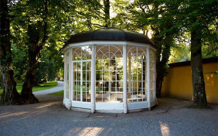 Gazebo from "The Sound of Music" tour in Salzburg, surrounded by trees.