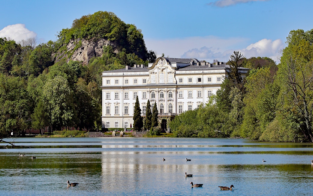 Schloss Leopoldskron by a lake in Salzburg, featured in the Sound of Music tour.