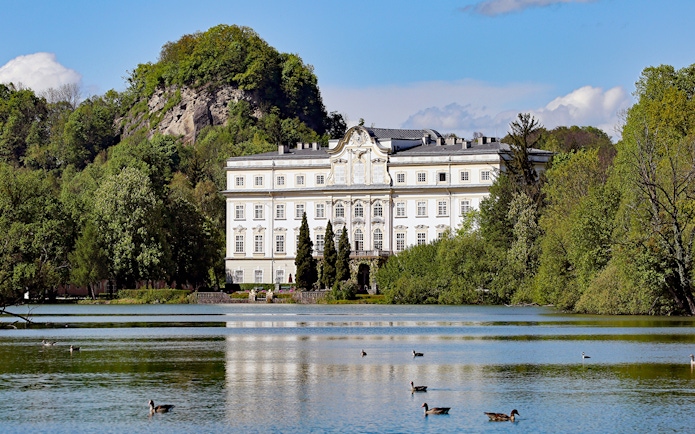 Schloss Leopoldskron by a lake in Salzburg, featured in the Sound of Music tour.