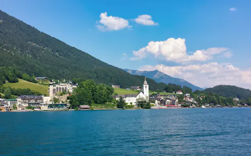 Salzkammergut lake with mountains and village view on tour from Salzburg.