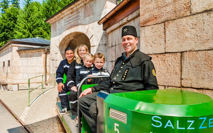 Tourists on a train at the entrance of Berchtesgaden Salt Mine, Bavaria.