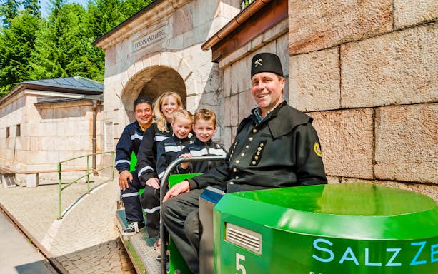 Tourists on a train at the entrance of Berchtesgaden Salt Mine, Bavaria.