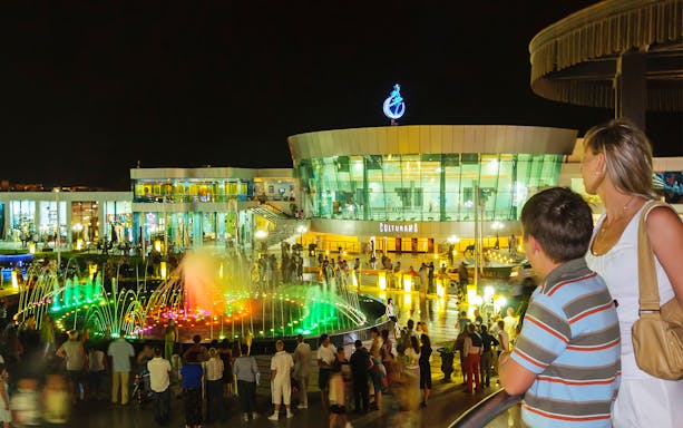 SOHO Square at night with colorful fountain and visitors, Sharm El Sheikh city tour.