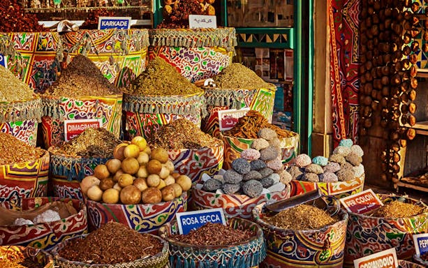 Colorful spice market display in Sharm El Sheikh during city tour with Al Mustafa Mosque and SOHO Square.