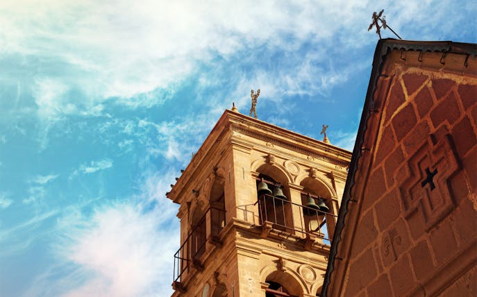 St. Catherine’s Monastery bell tower under a blue sky, Sharm-El-Sheikh tour.