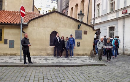 Visitors outside a historic building in the Jewish Quarter, Prague, with skip-the-line tickets.