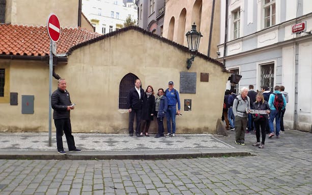 Visitors outside a historic building in the Jewish Quarter, Prague, with skip-the-line tickets.