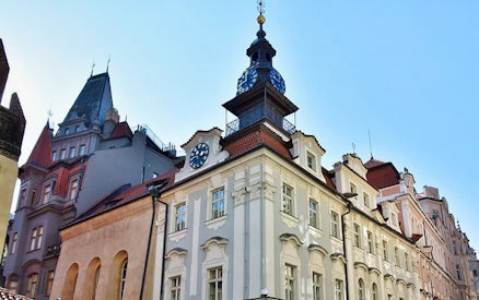 Jewish Quarter building with clock tower in Prague, part of escorted skip-the-line tour.