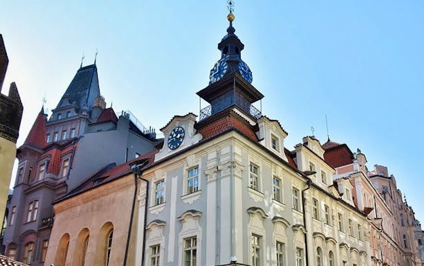 Jewish Quarter building with clock tower in Prague, part of escorted skip-the-line tour.
