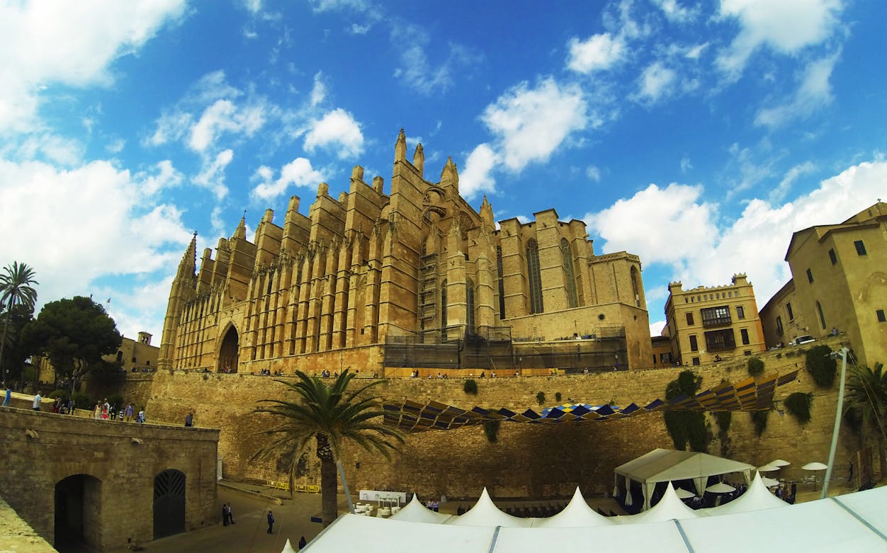 La Seu Cathedral in Palma, Mallorca, viewed from below with blue sky.