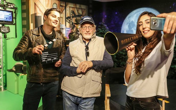 Visitors posing with film set props at Madame Tussauds Istanbul.