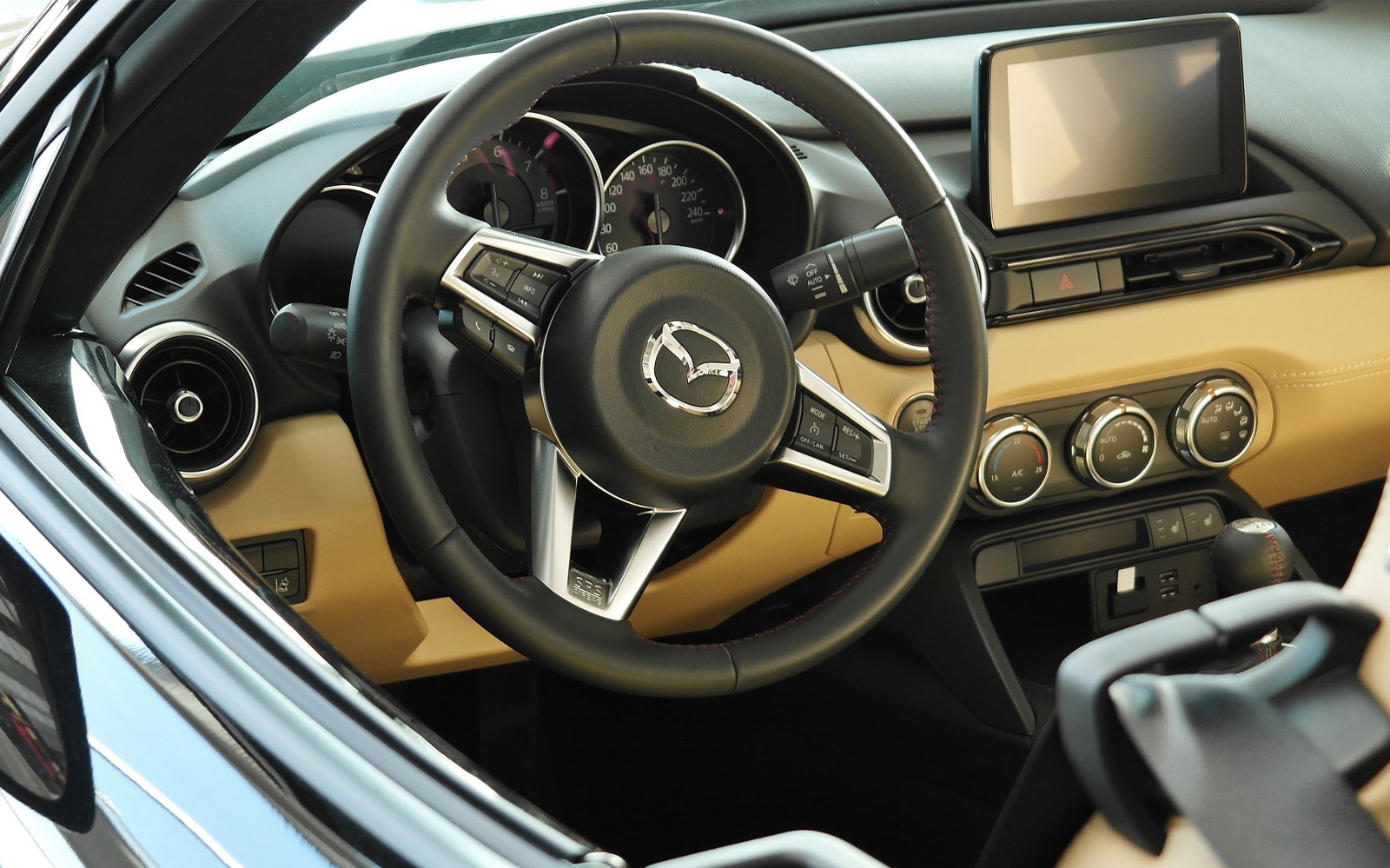 Steering wheel and dashboard of a private transfer vehicle in Hurghada.