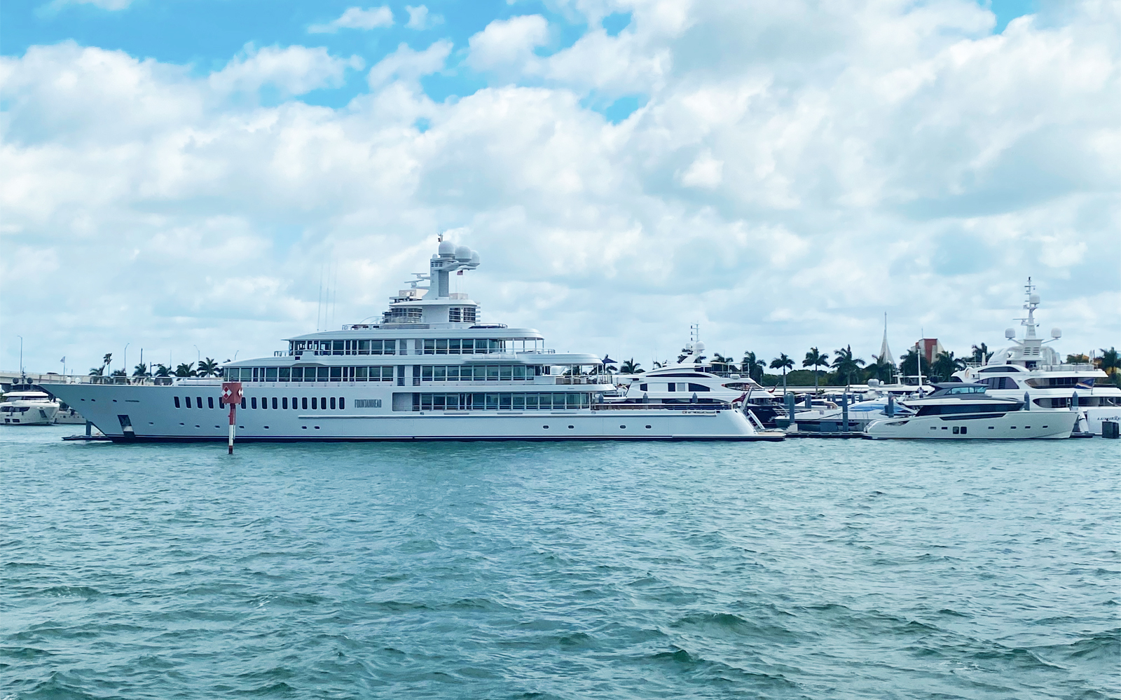 Luxury yacht docked in Miami marina, part of Everglades cruise tour.