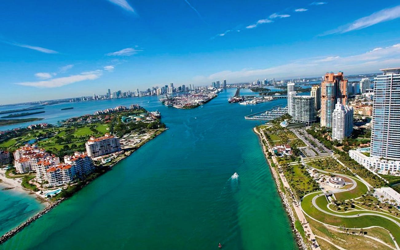 Aerial view of Miami skyline and bay, highlighting cruise route for Miami Movie Tour.