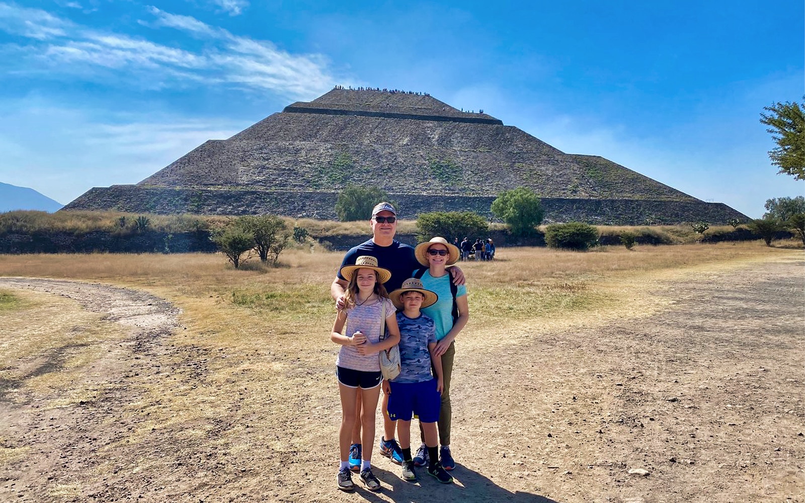 Family in front of Pyramid of the Sun, Teotihuacan, during private tour.
