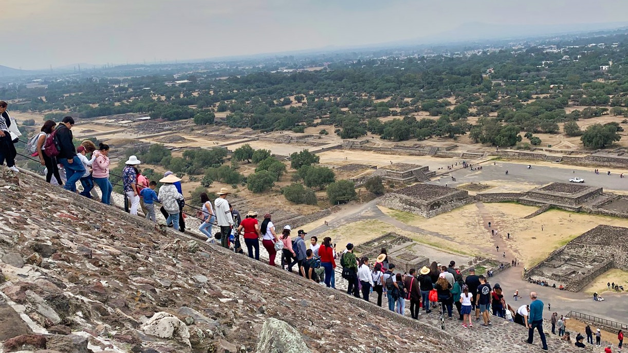 Tourists climbing the Pyramid of the Sun at Teotihuacan, Mexico.