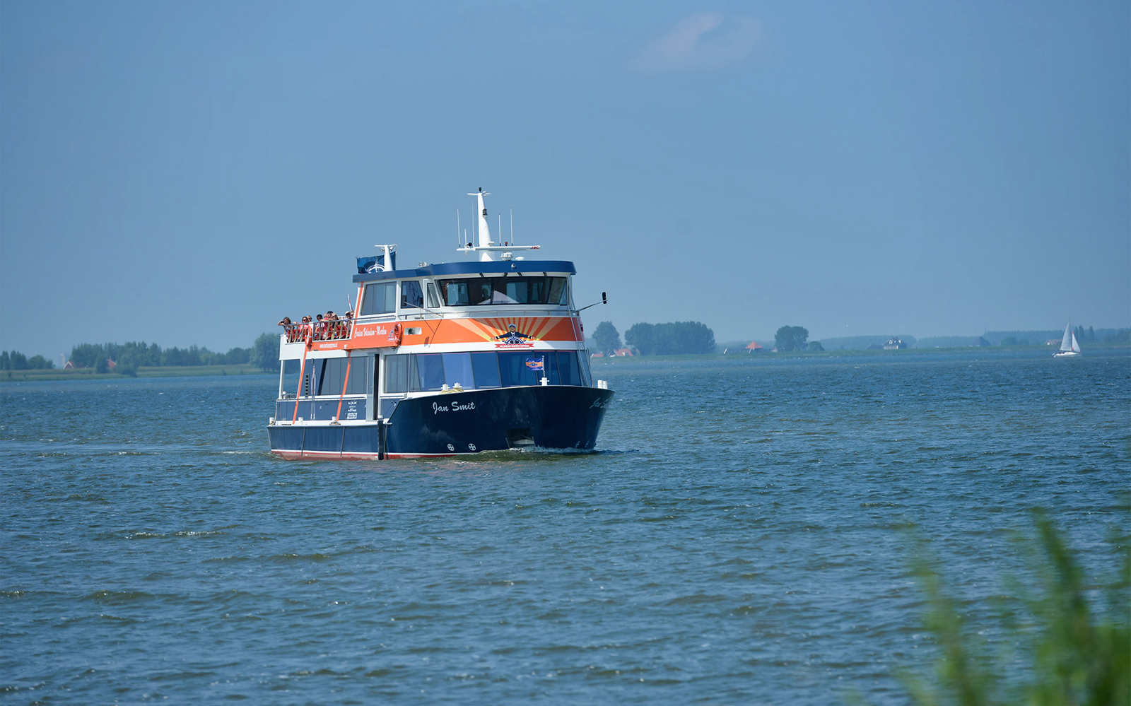 Boat on water during E-scooter tour of Volendam, Monnickendam, and Marken.