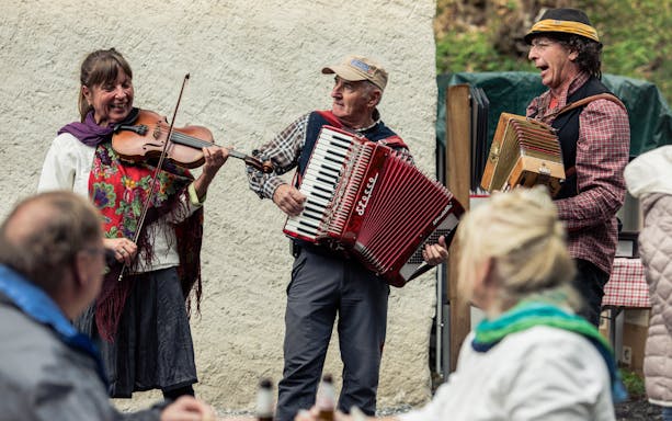 Musicians playing violin and accordion at Ballenberg Swiss Open-Air Museum.